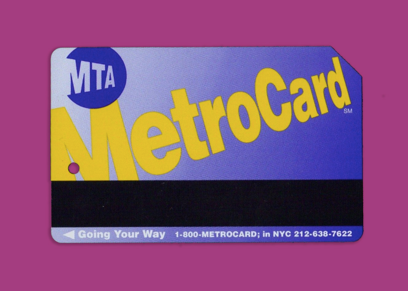 The very first MetroCards had a blue background with gold text. Later MetroCards used the same design but with a gold background and blue text. (Image: eBay / Gizmodo)